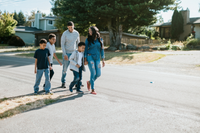 family walks in neighborhood